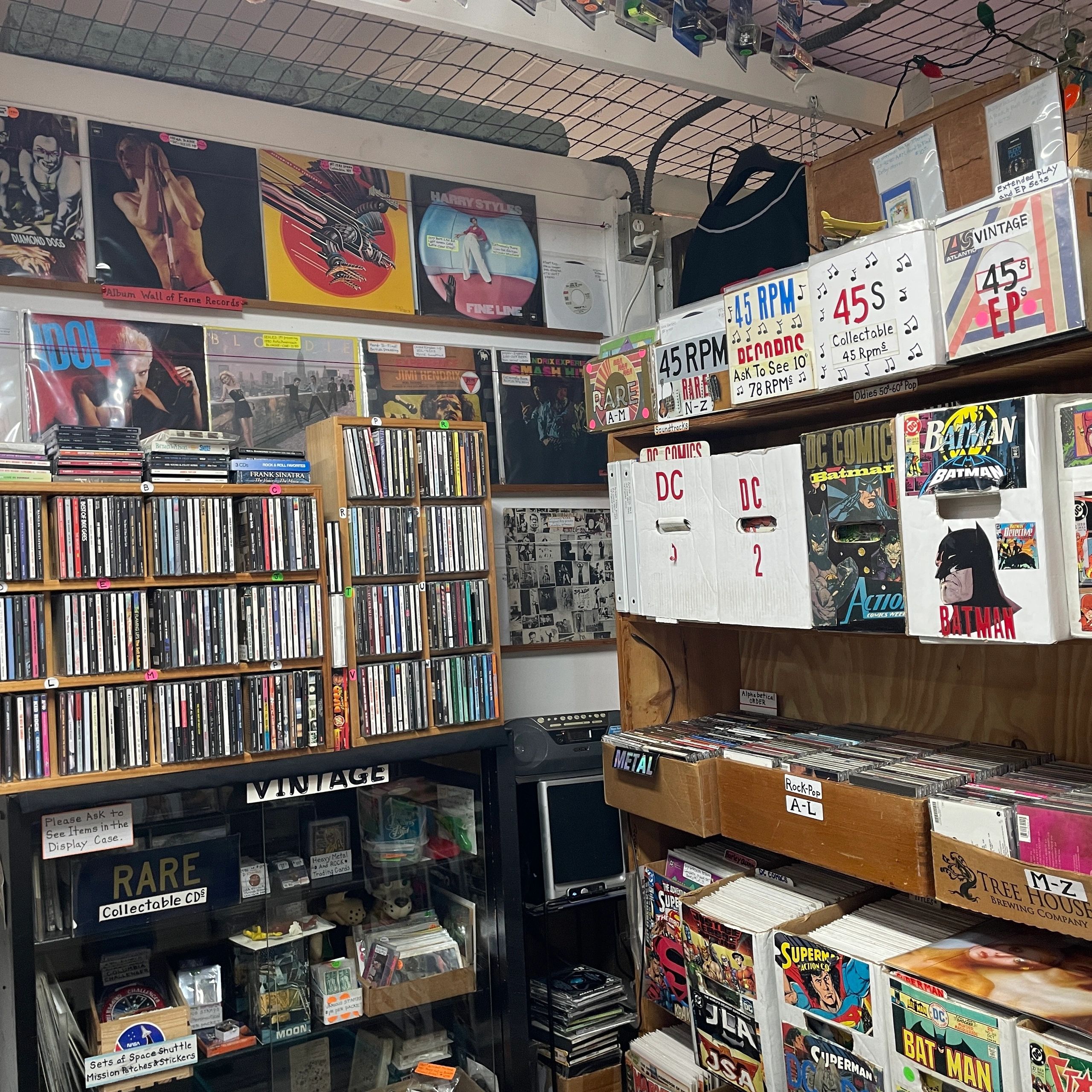 Vintage music and comic shop with records, CDs, and collectibles