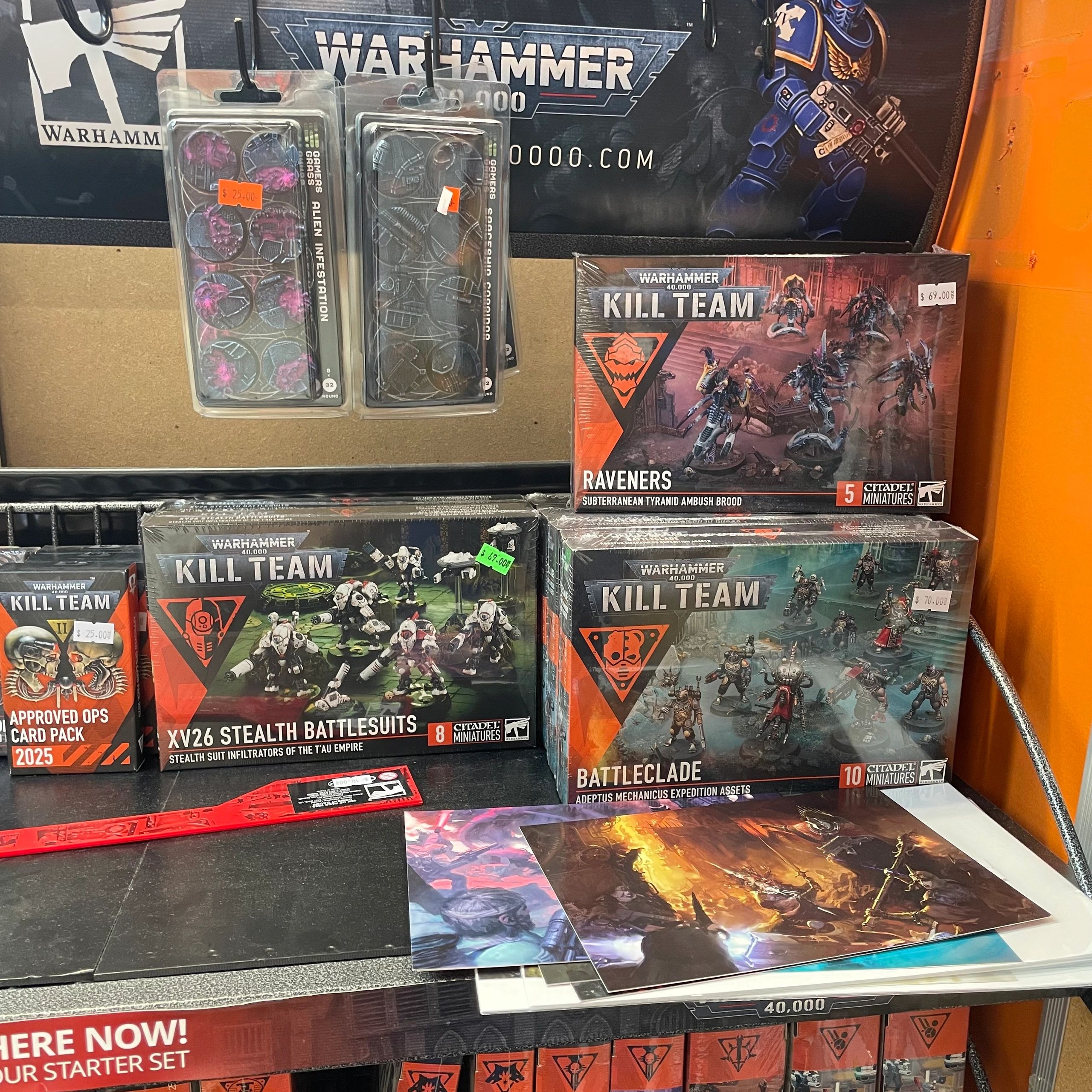 Display of Warhammer 40,000 Kill Team miniatures and accessories on a table