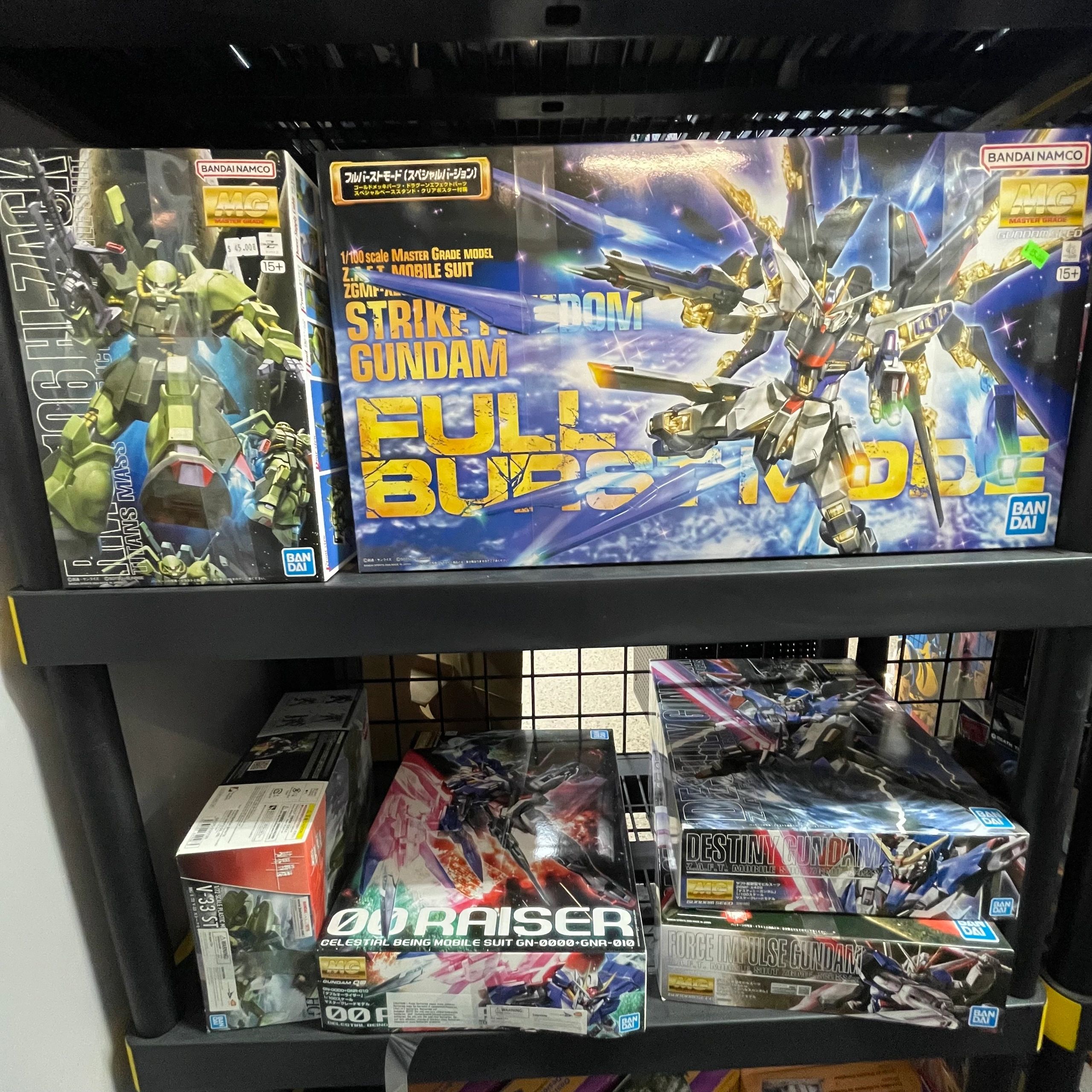 Gundam model kit boxes on shelves