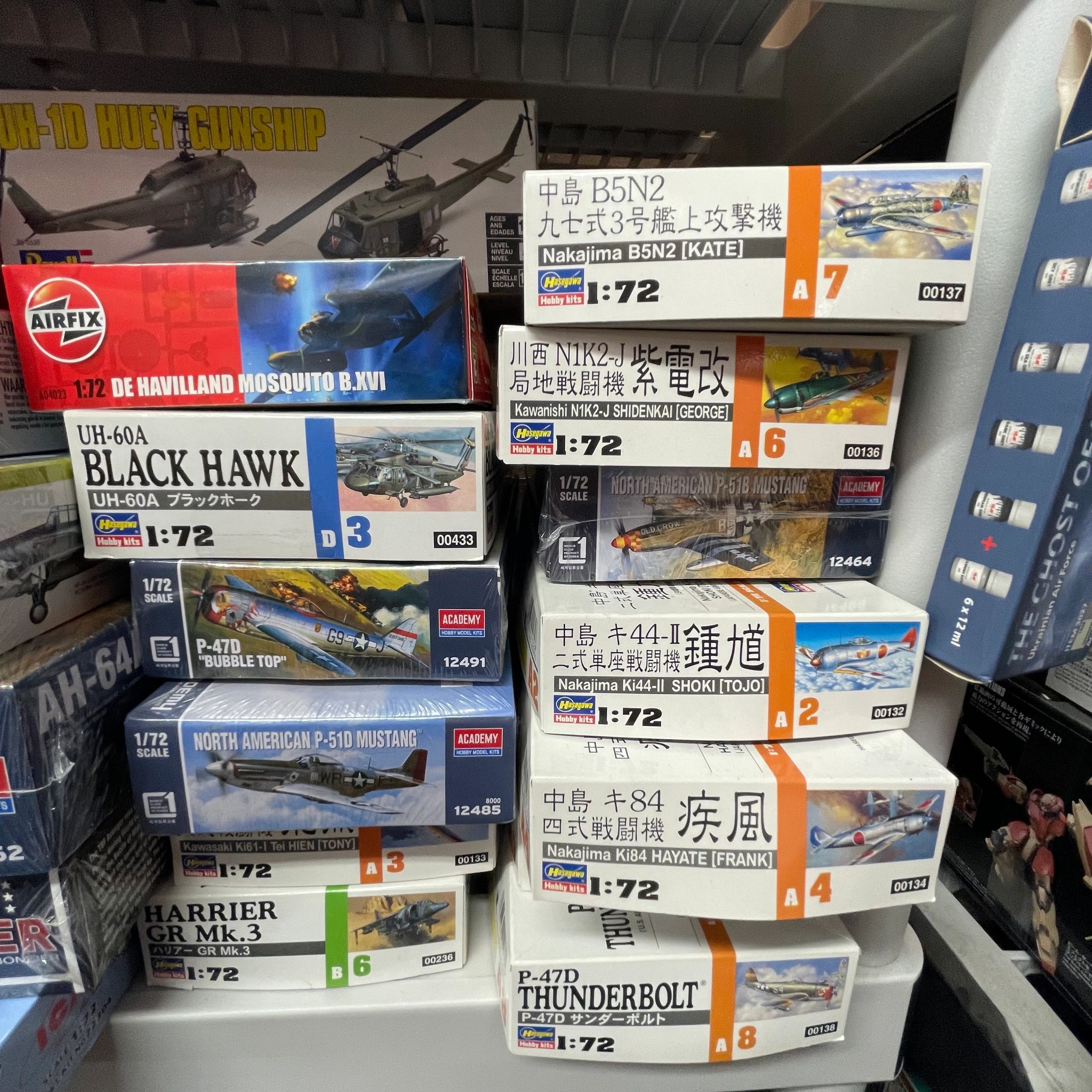 Stack of 1:72 scale model airplane kits from various brands