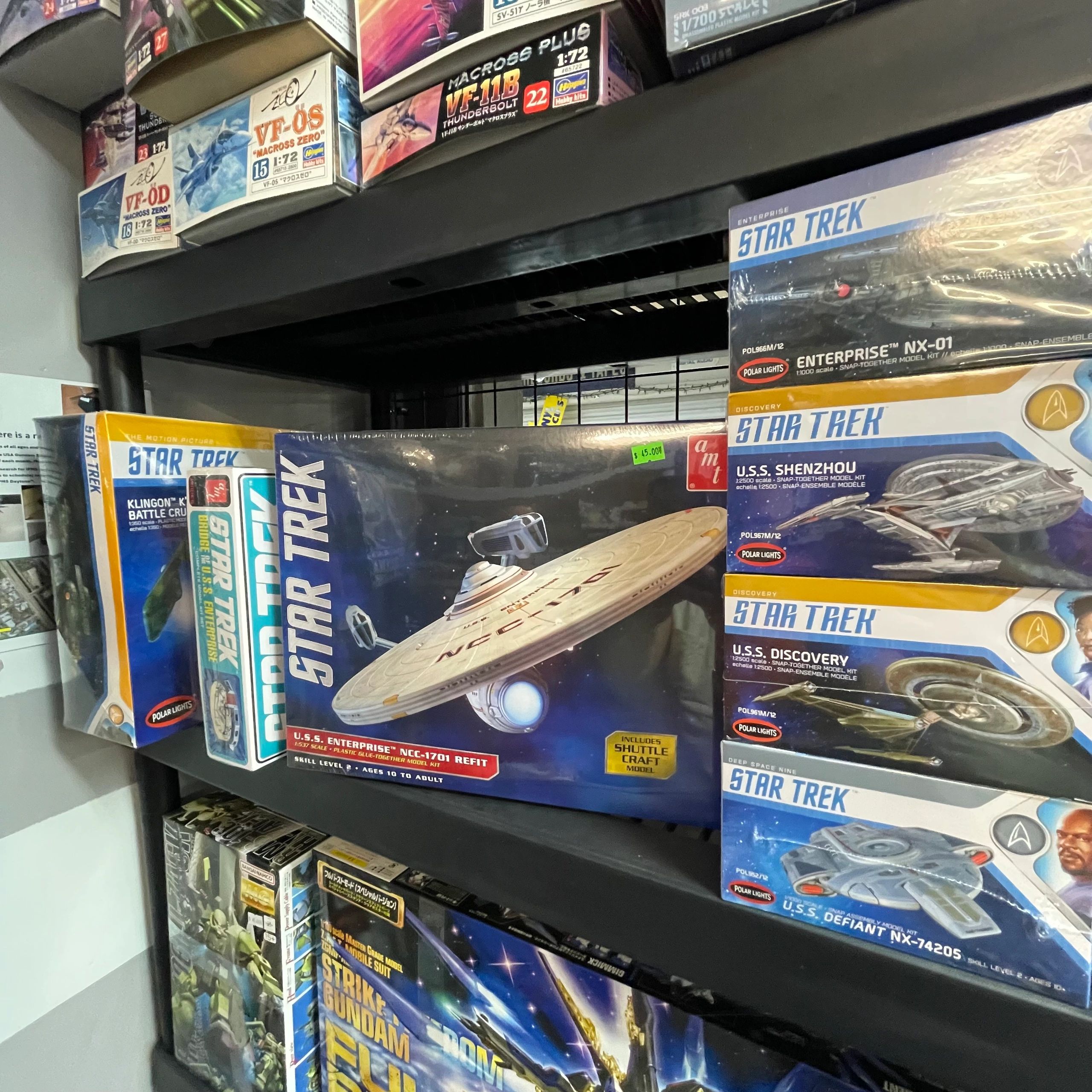 Star Trek model kits displayed on shelves in a hobby store