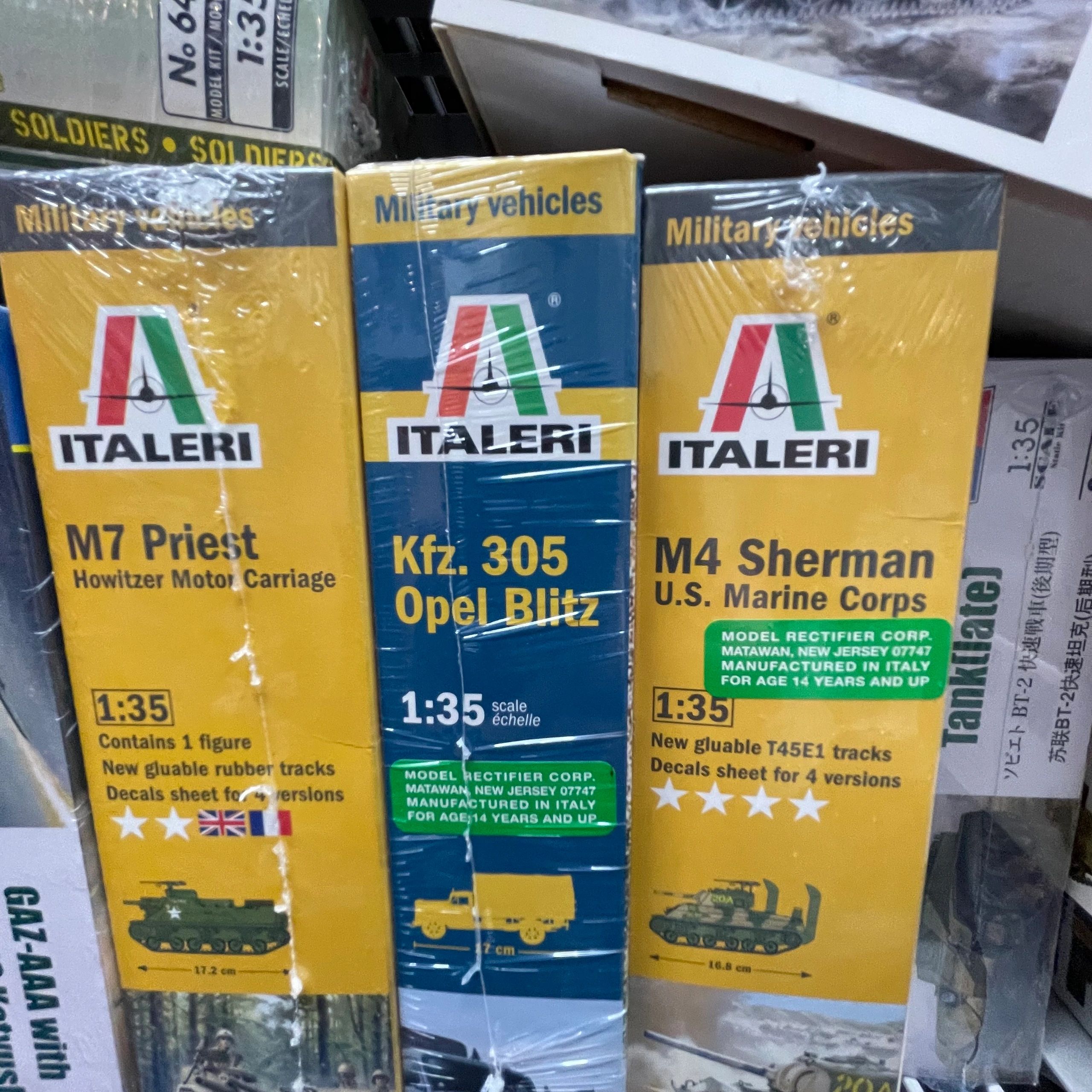 Three Italeri 1:35 scale military vehicle model kits in packaging