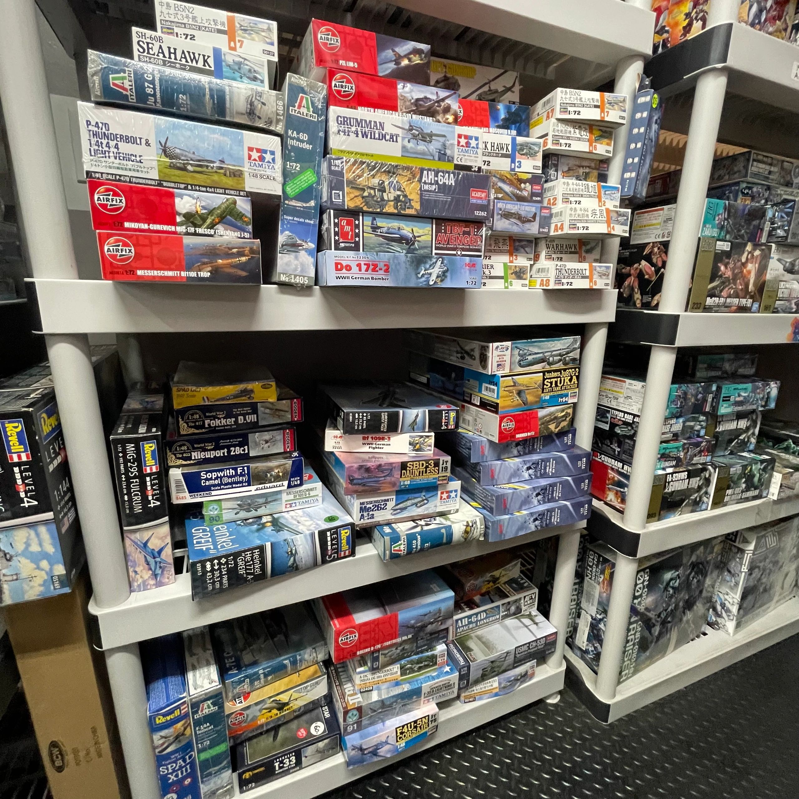 Shelves filled with boxed model airplane kits in a hobby store