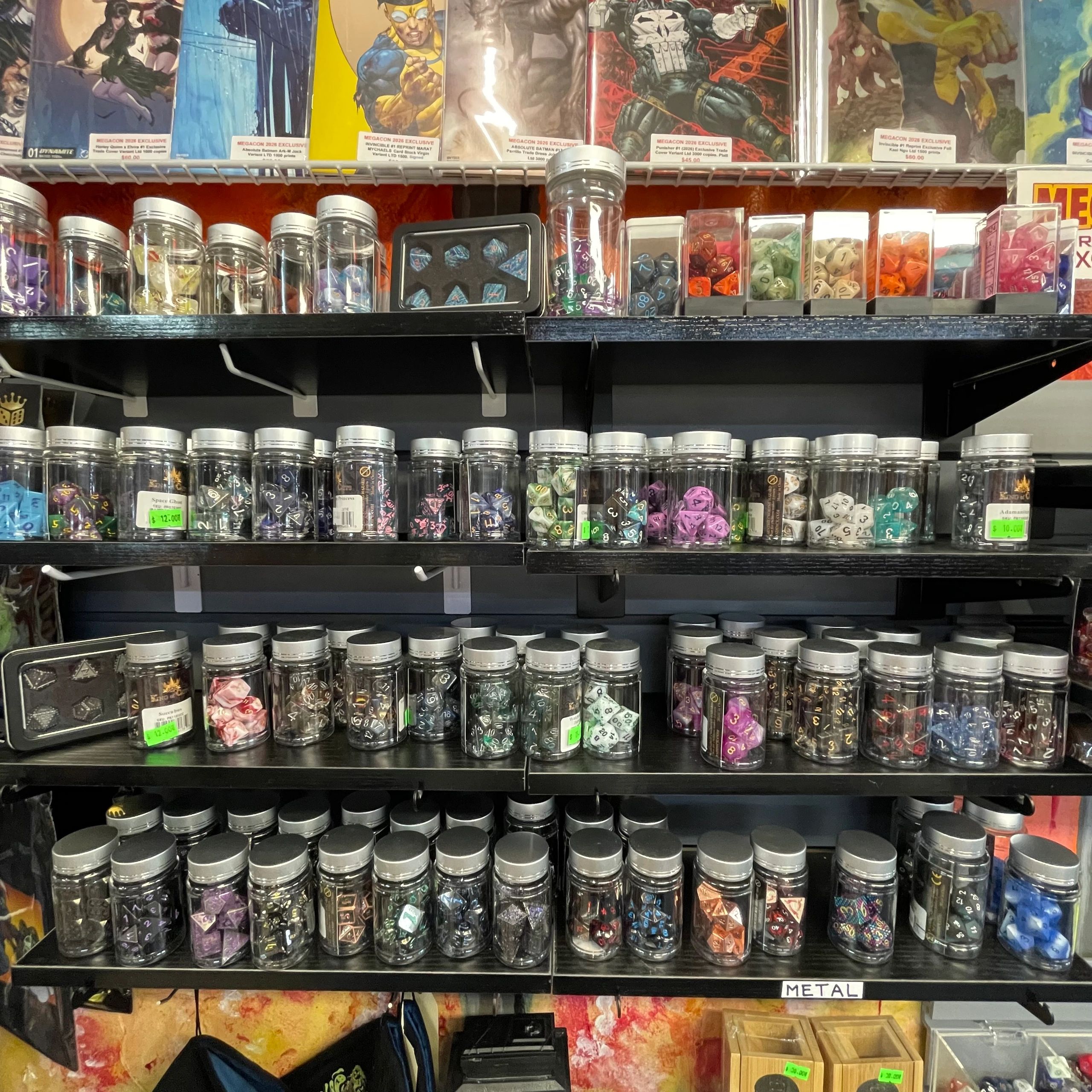Gaming dice on shelves at Goblin's Cave