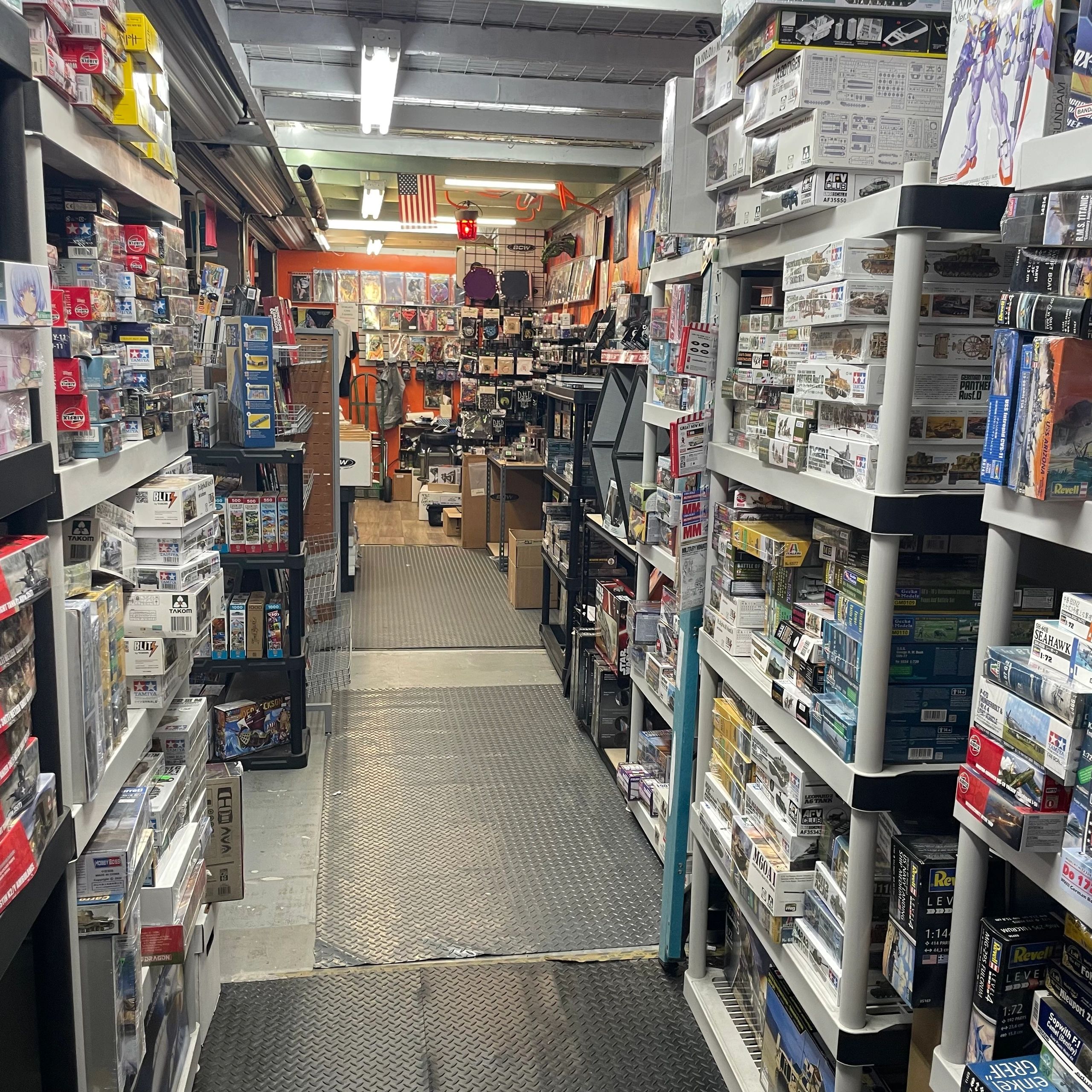 A hobby store aisle filled with model kits and collectibles.